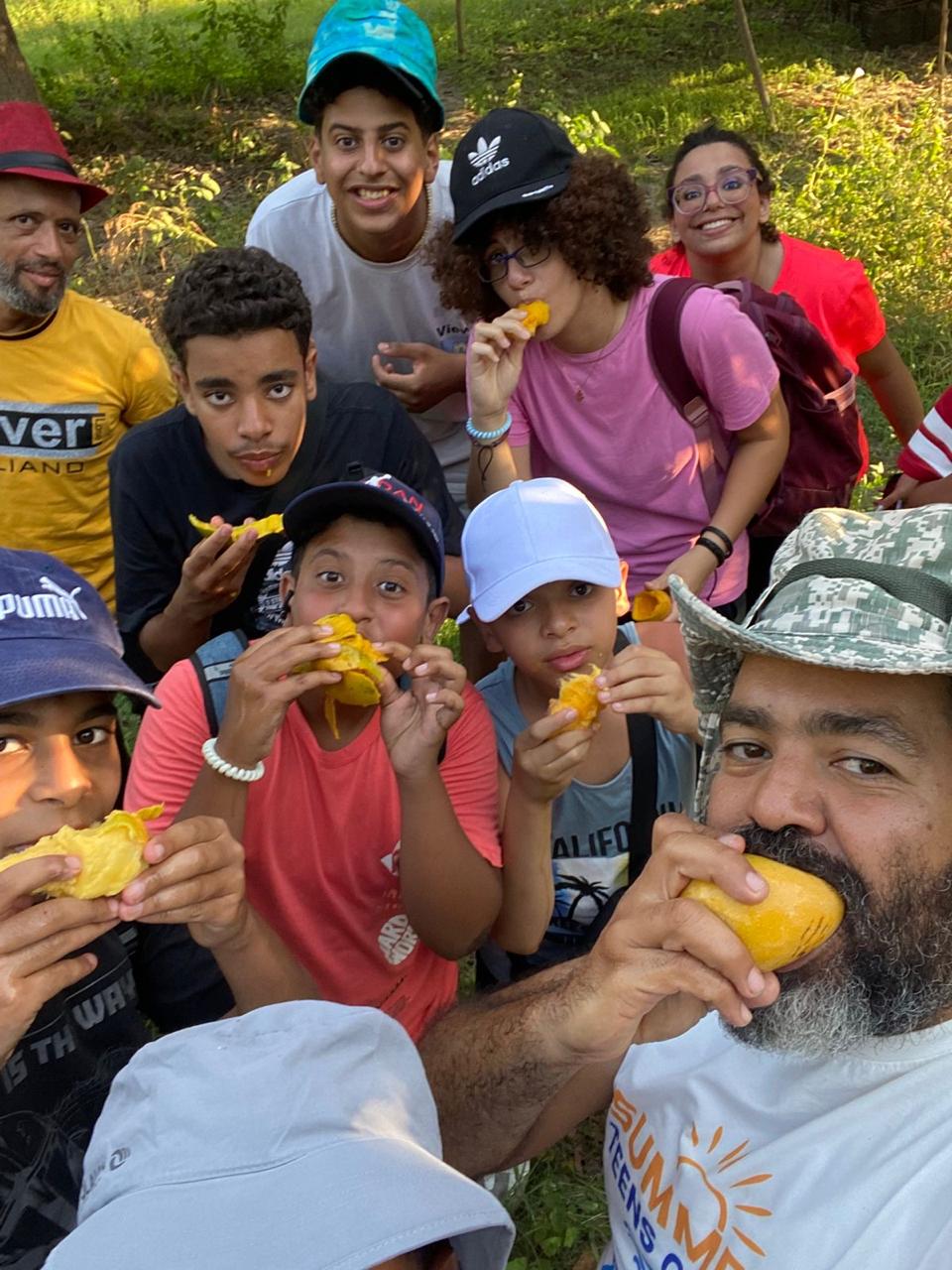 Camp participants resting during a mountain hiking experience